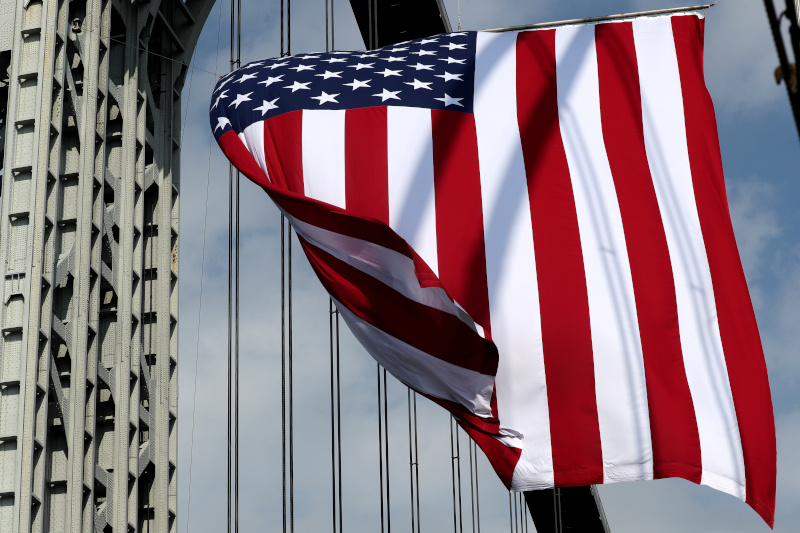 US flag flies from the George Washington Bridge between New York and New Jersey on June 14, 2021 (by Mike Sugar/Reuters)